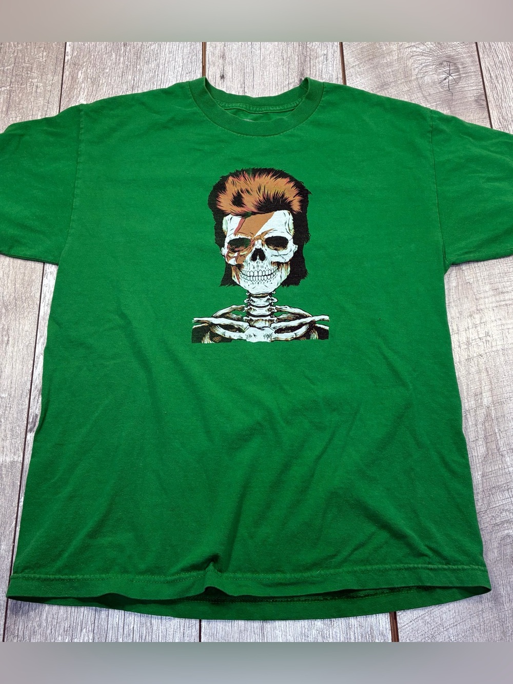David Bowie skeleton graphic tee. Women’s size large minor tiny pinhole in front